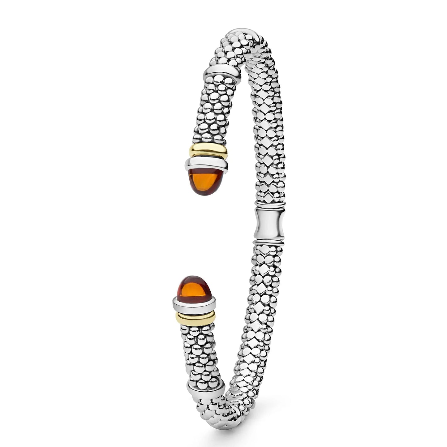 A silver-toned textured bangle bracelet with amber-colored cabochon stones at each end, accented with gold-toned metal bands, shown on a plain white background.