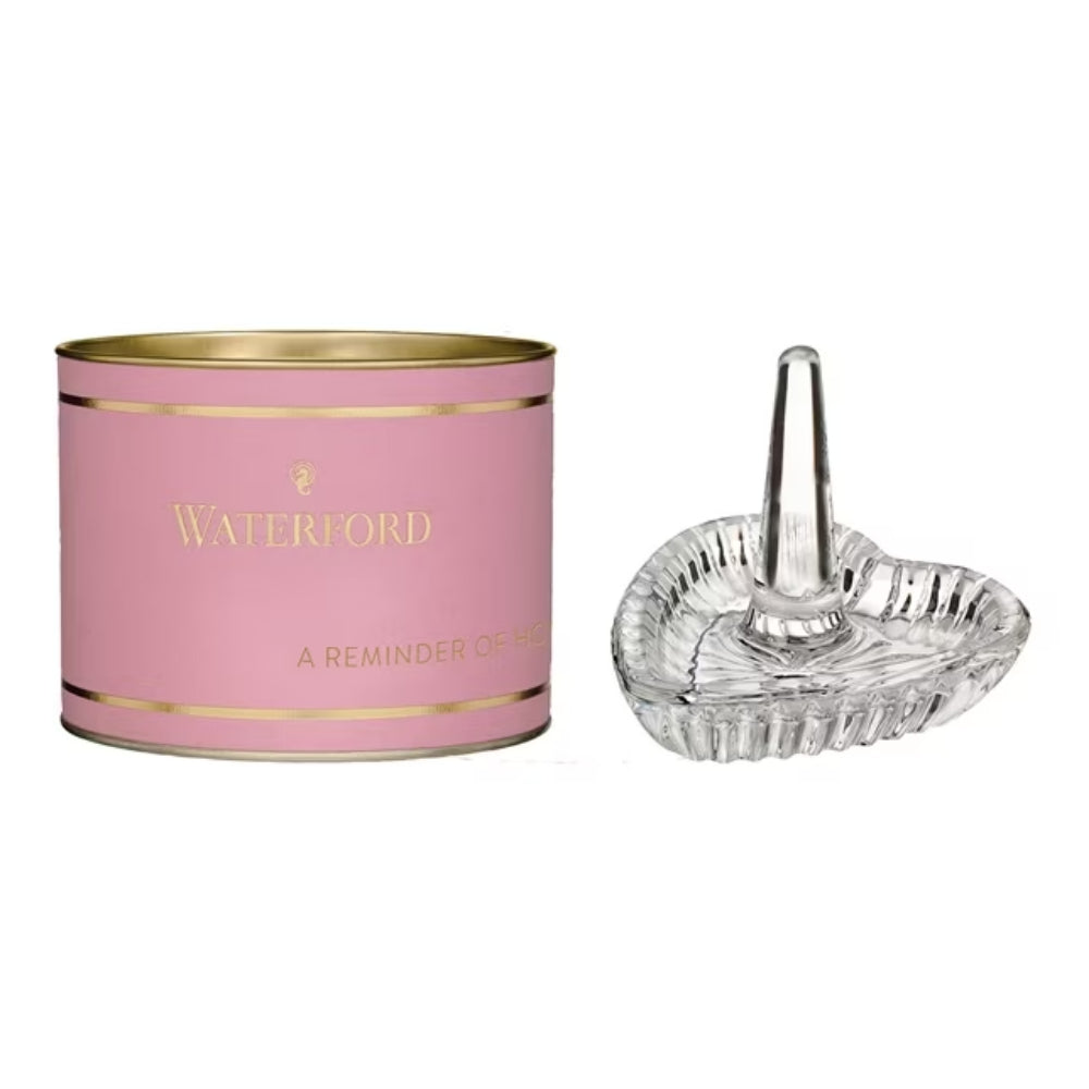 Pink tin with gold accents and 'Waterford' branding next to a clear glass ring holder dish on a white background.