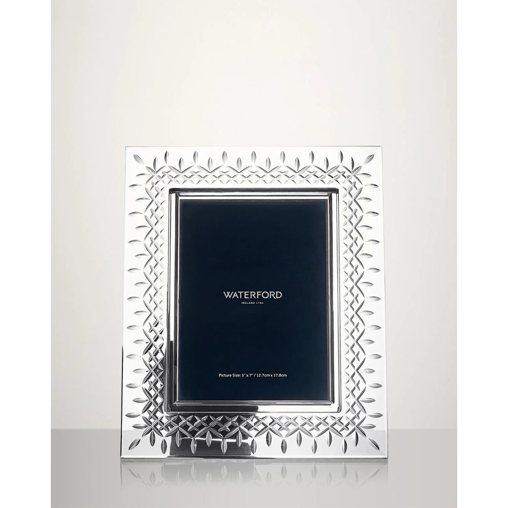 A crystal 5x7 picture frame from Waterford on a clear background.