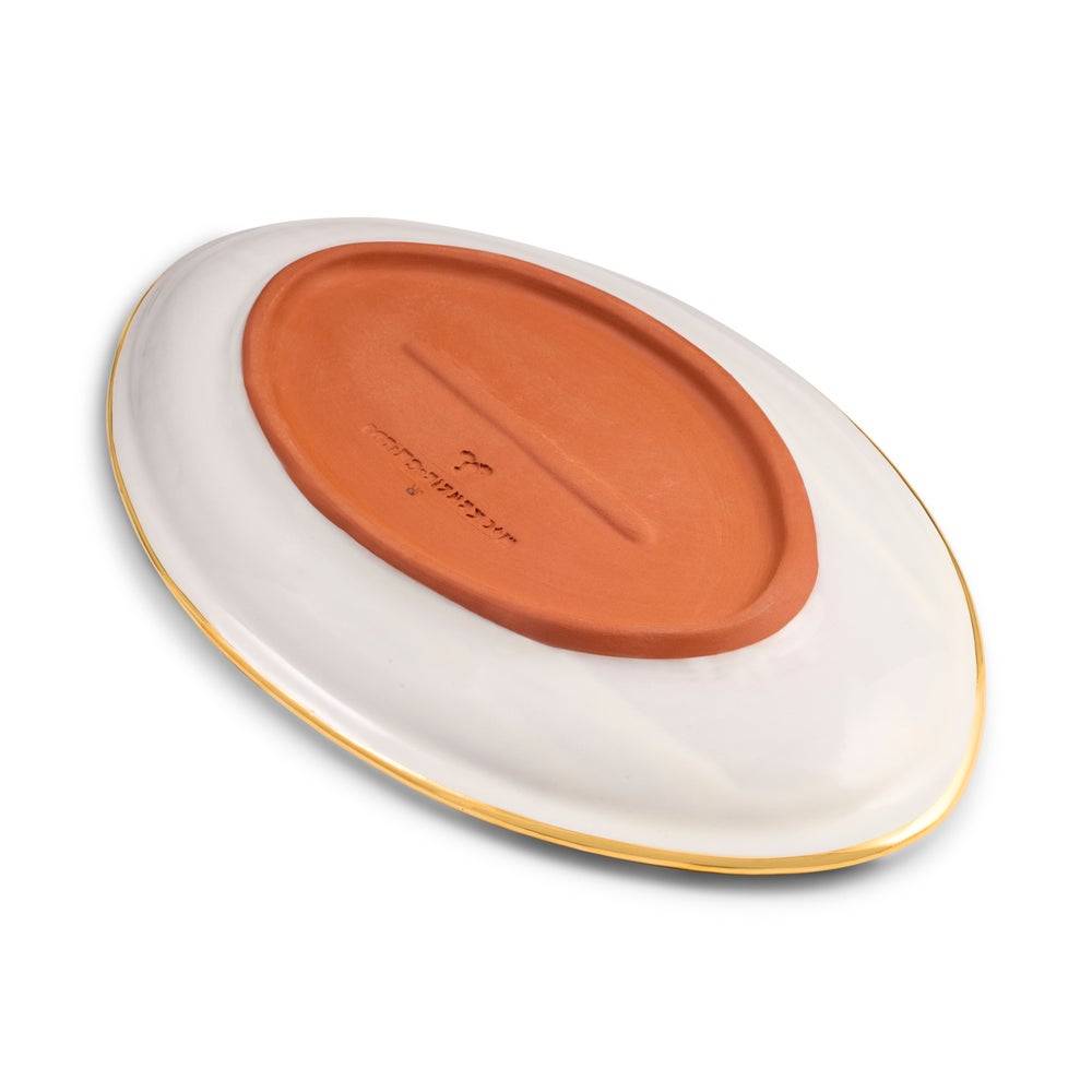 MacKenzie-Childs Indigo Check Ceramic Football Platter on a white background