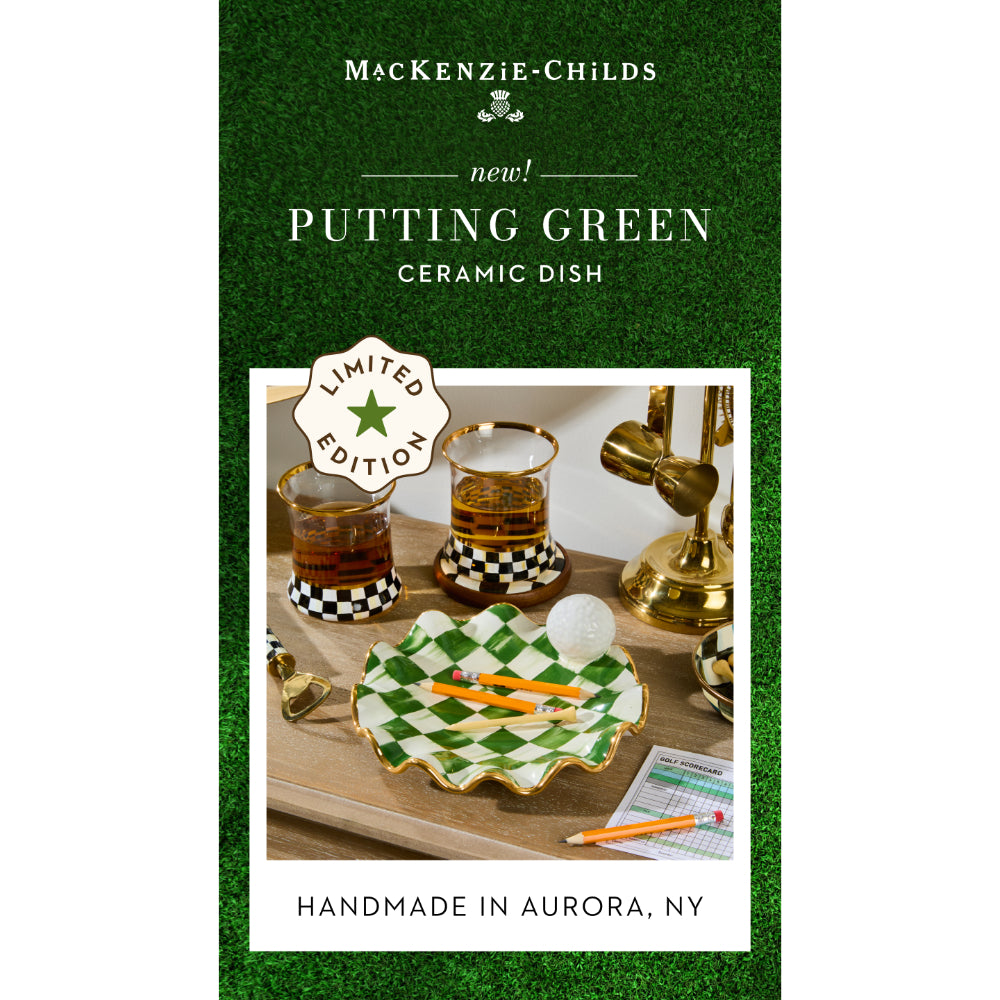 Advertisement for a 'Putting Green' ceramic dish by MacKenzie-Childs on a green background.