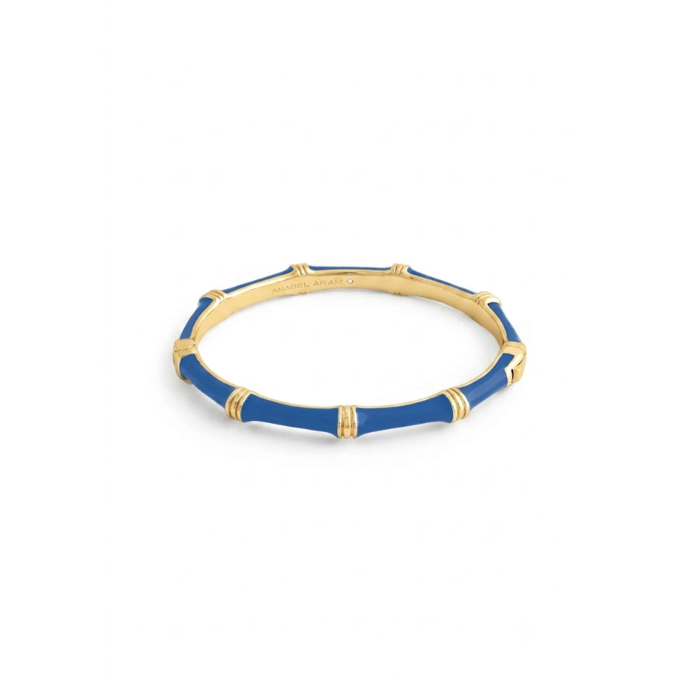 A gold-plated bangle bracelet with a blue enamel bamboo-inspired pattern, shown on a plain white background.