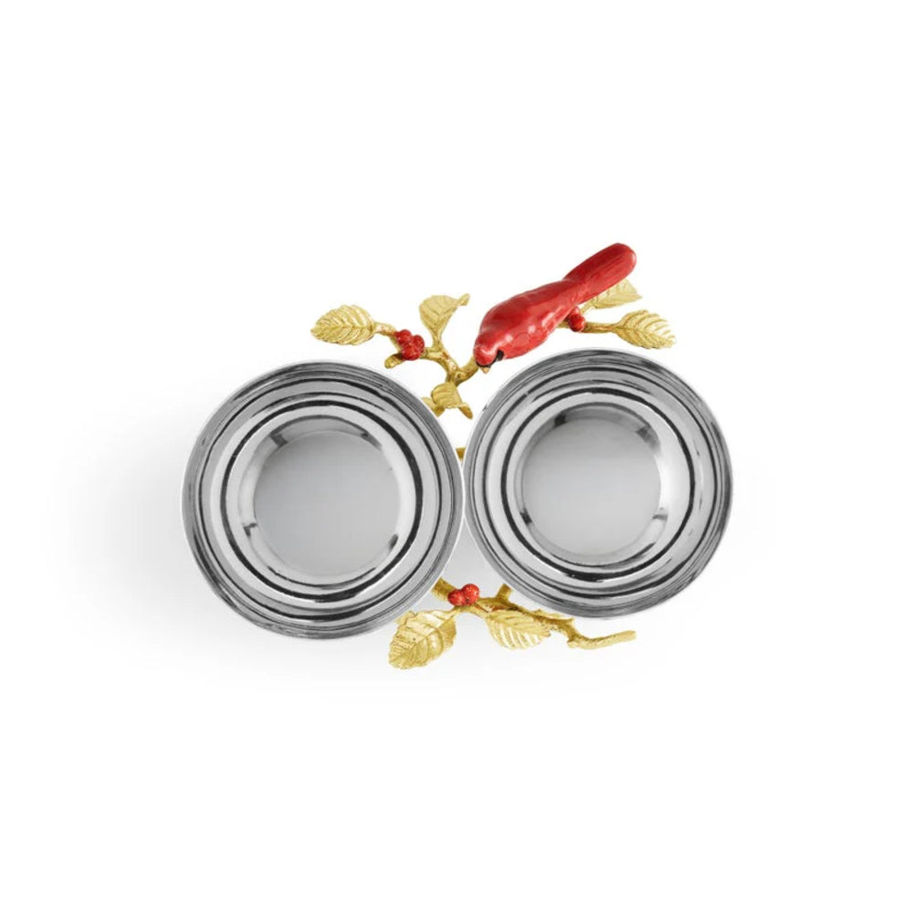 Decorative silver bowls with gold and red accents on a white background