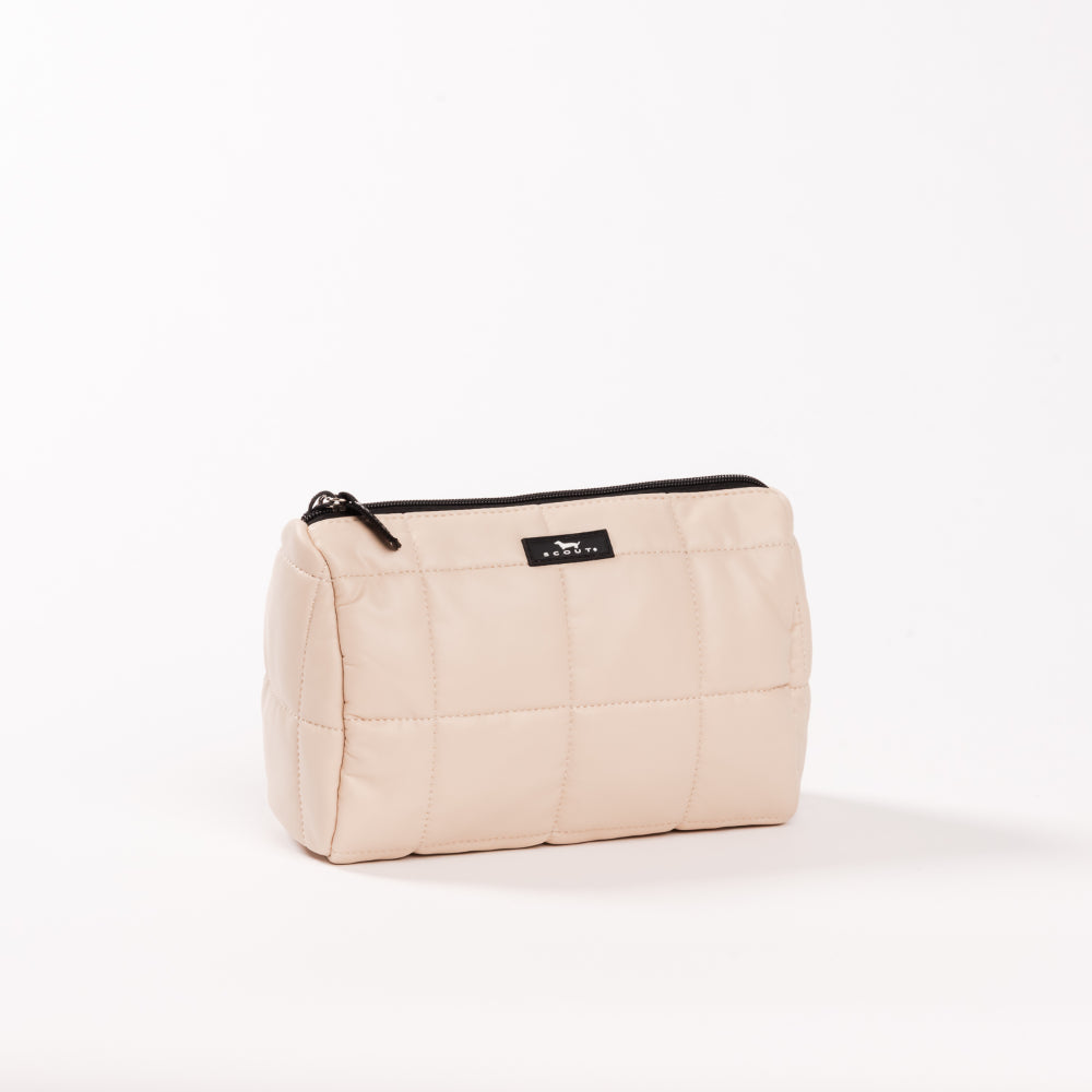 Beige toiletry bag with a black zipper on a white background