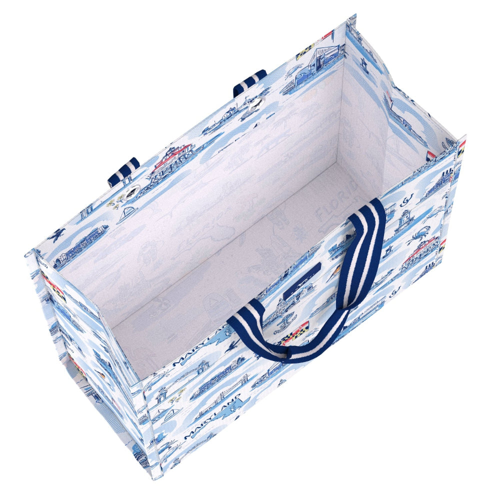 A rectangular storage tote bag with a blue and white winter nautical print, featuring thick navy blue handles with white stripes, shown on a solid white background.