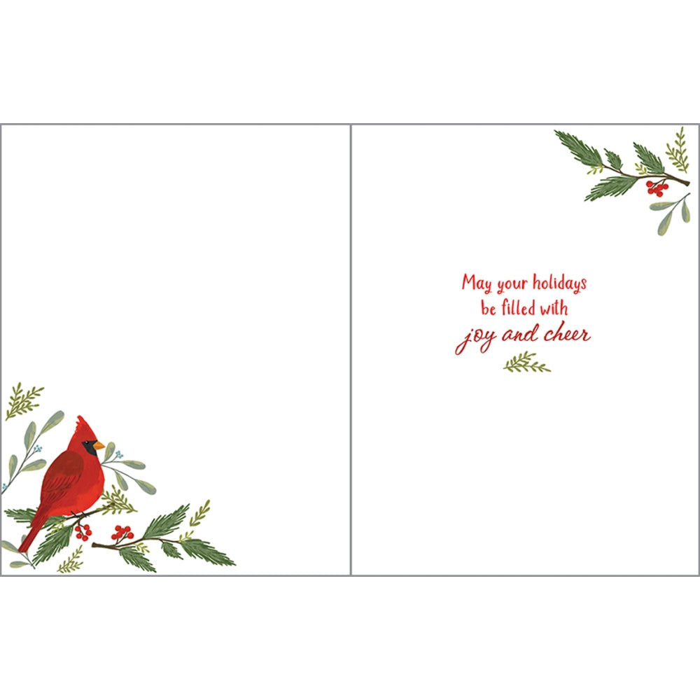 A two-panel greeting card design with a red cardinal perched on green and red holiday branches in the lower left corner of the left panel, and the phrase 'May your holidays be filled with joy and cheer' in red script on the right panel.