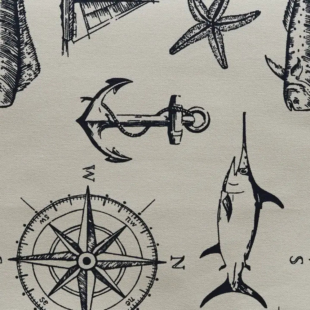Close up of Captain's Quarters design on table runner. Designs include on table runner are swordfishes, anchors, compasses, and many more.