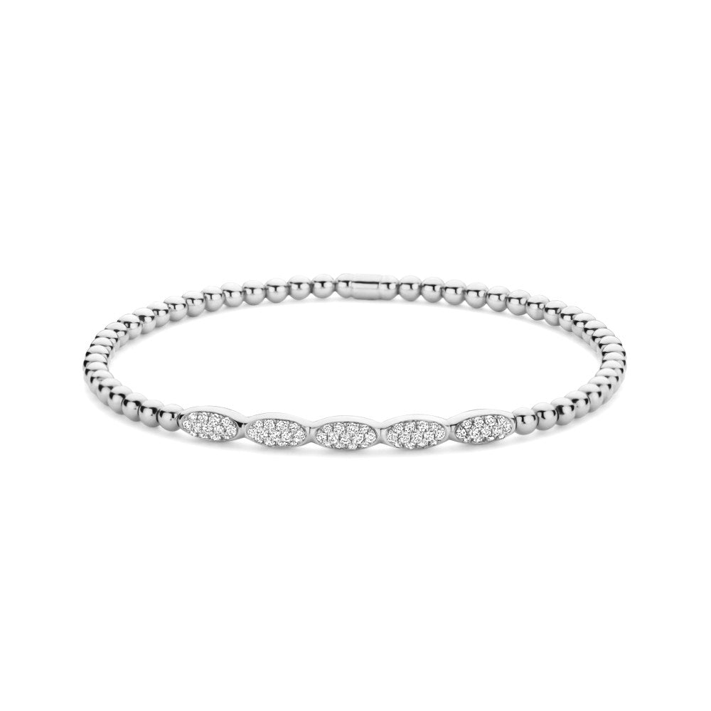 Silver bracelet with diamond accents on a white background