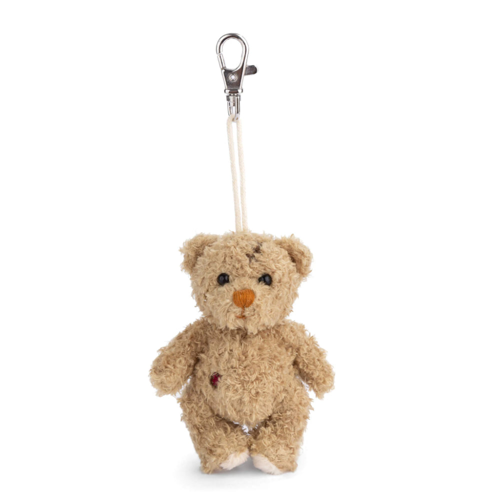 Small beige teddy bear keychain with a clip on a white background.