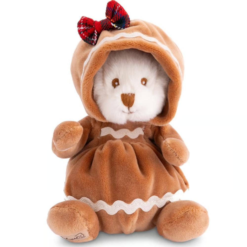 A white plush teddy bear wearing a brown hooded dress with white wavy trim and a red plaid bow on the hood, photographed on a clean white background.