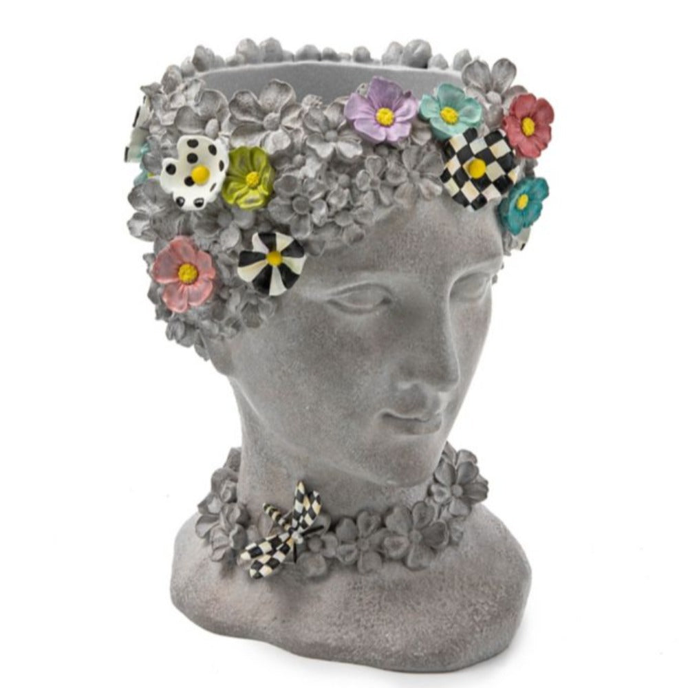 Gray bust with colorful floral wreath on a white background