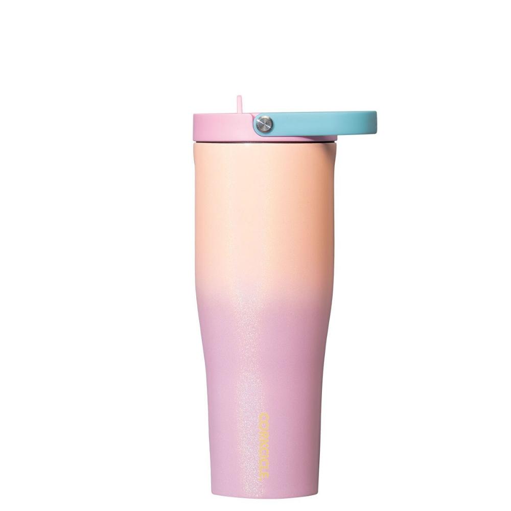 Pink and orange tumbler with pink lid and a light blue handle on a white background.