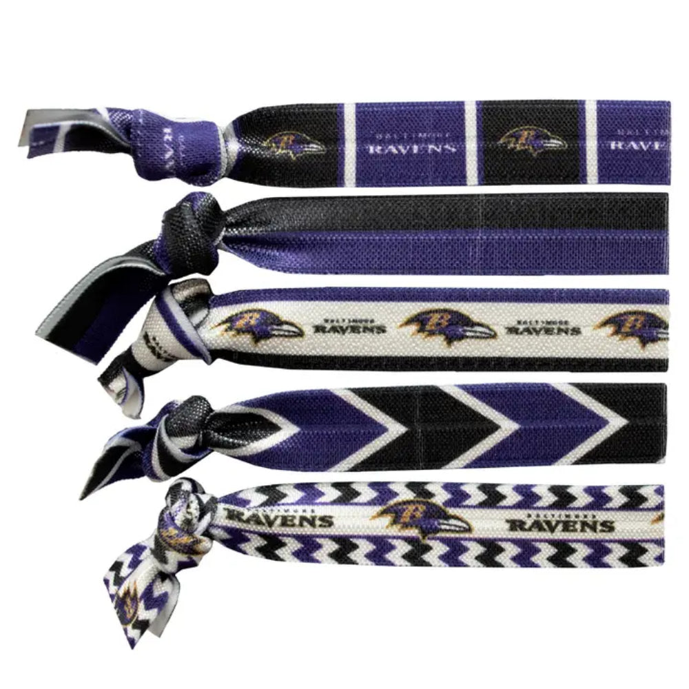 Four knotted fabric hair ties featuring Baltimore Ravens team graphics, including team logos, 'BALTIMORE RAVENS' text, and chevron patterns in purple, black, white, and gray.