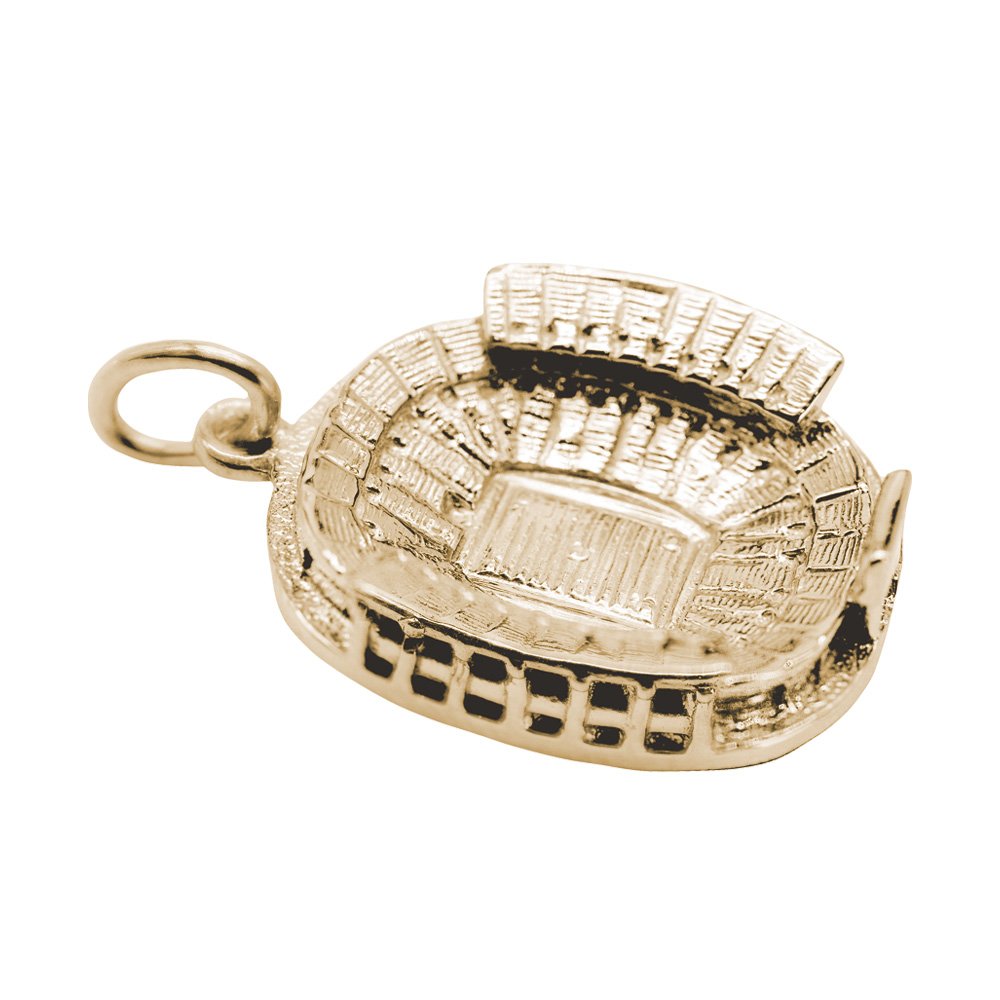 A gold stadium-shaped charm with detailed textured carvings, shown on a plain white background.