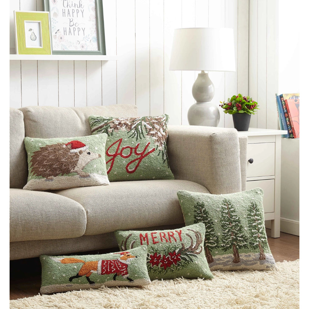 A room display of christmas pillows