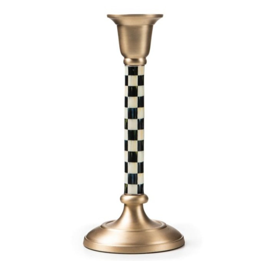 A small size decorative candle holder with checkered design and gold base on a white background