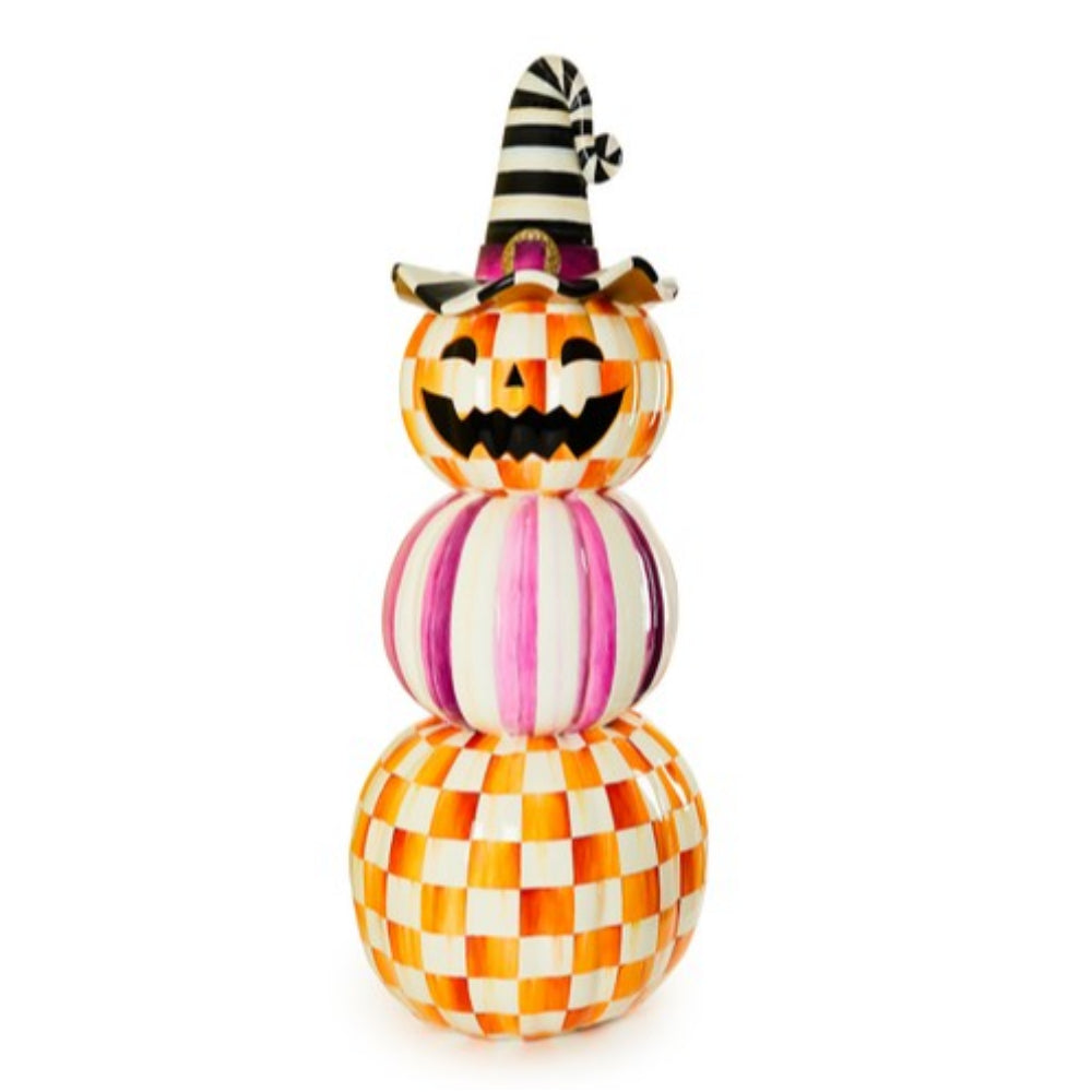 Stacked Halloween-themed pumpkins with checkered patterns and a striped hat on a white background