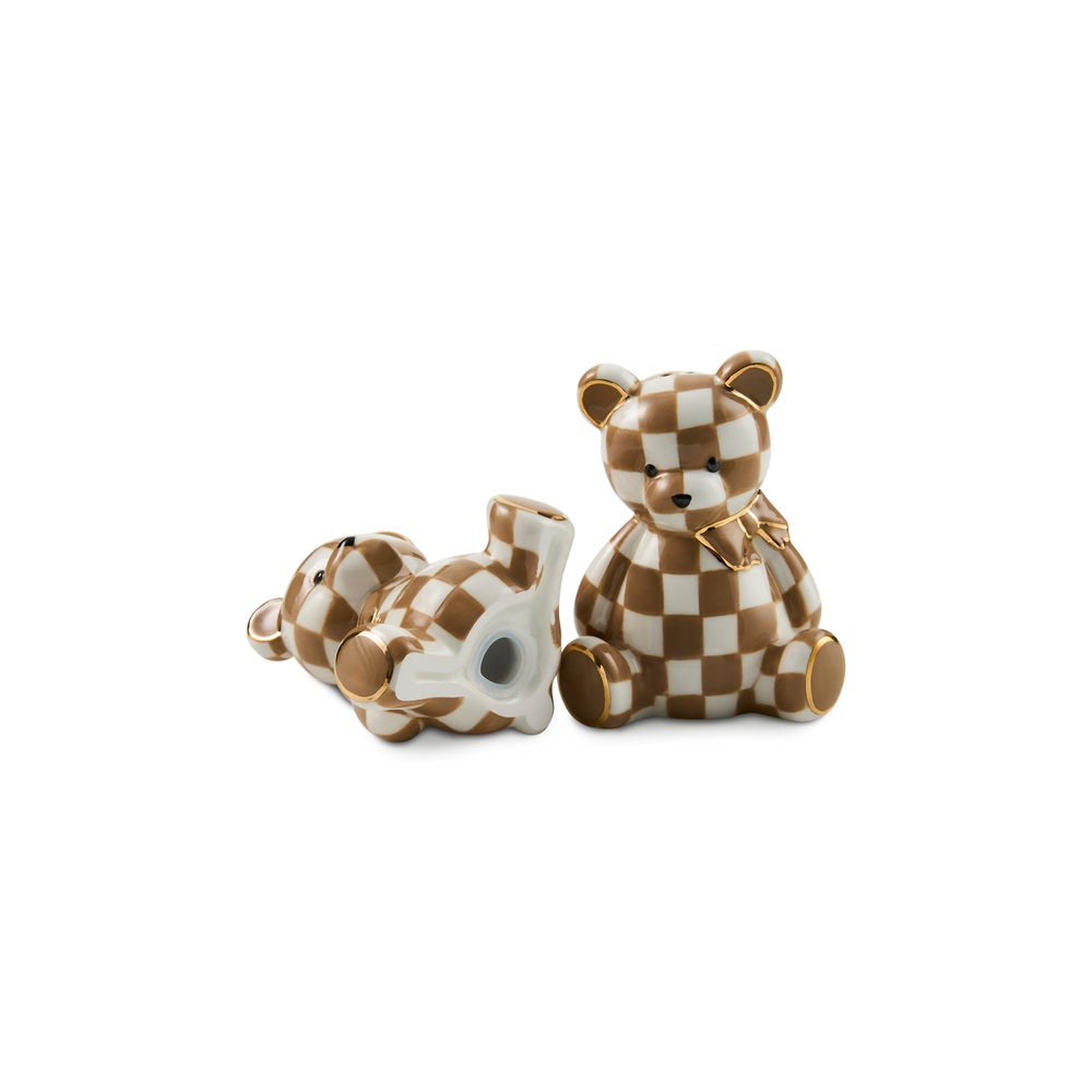 Two ceramic teddy bear figurines with a brown and white checkered pattern, one sitting upright and one lying on its back, set against a plain white background.
