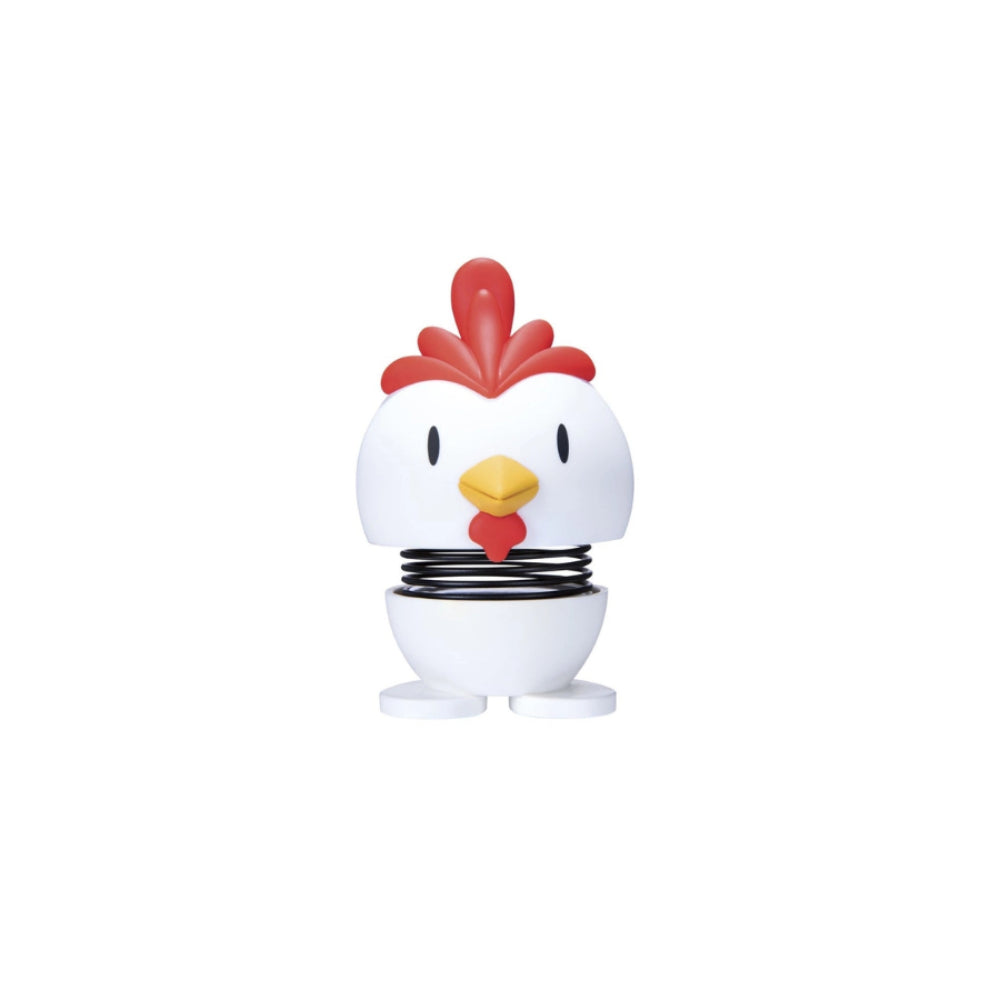 White and red rooster shaped figurine with a spring on a white background