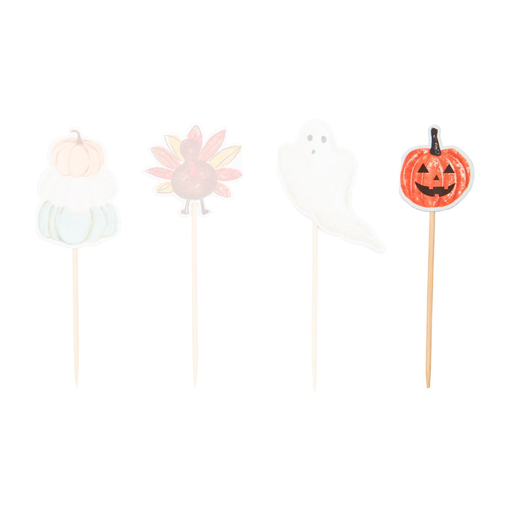 Pumpkin halloween-themed thoothpick sets of 24 with a orange paper pumpkin jack-o-lantern design on a toothpick on a white backround.