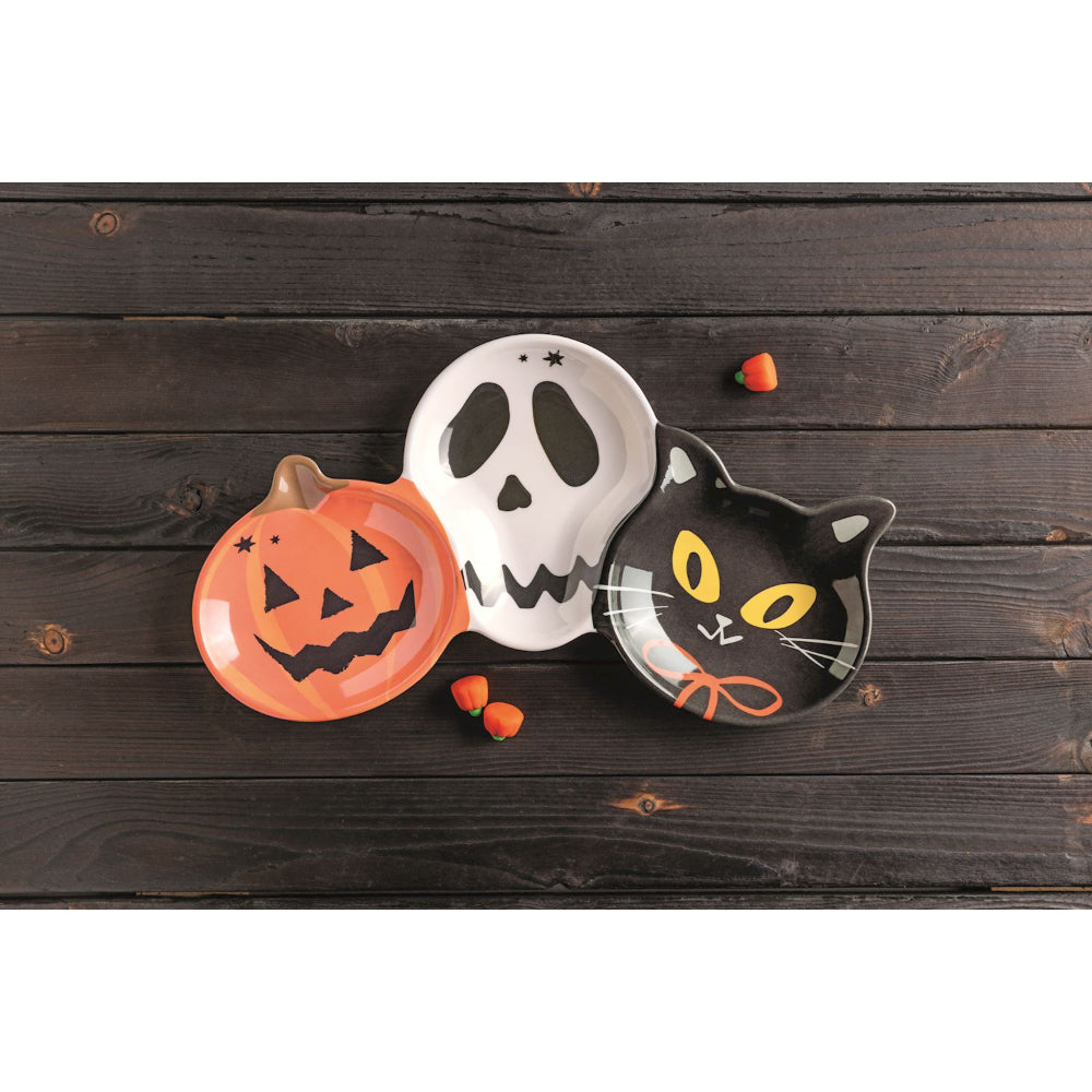 Halloween-themed ceramic tray on a wooden surface.