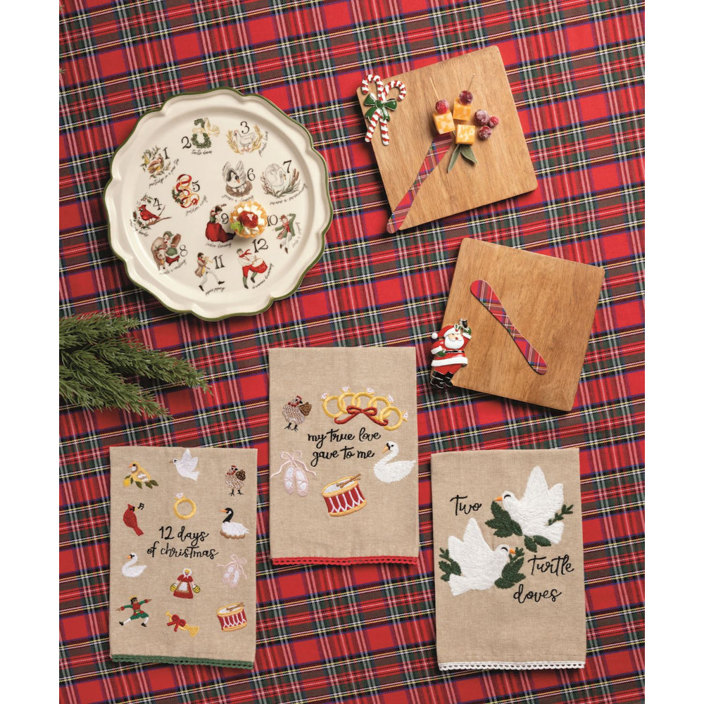 Christmas-themed coasters and platter on a red plaid tablecloth