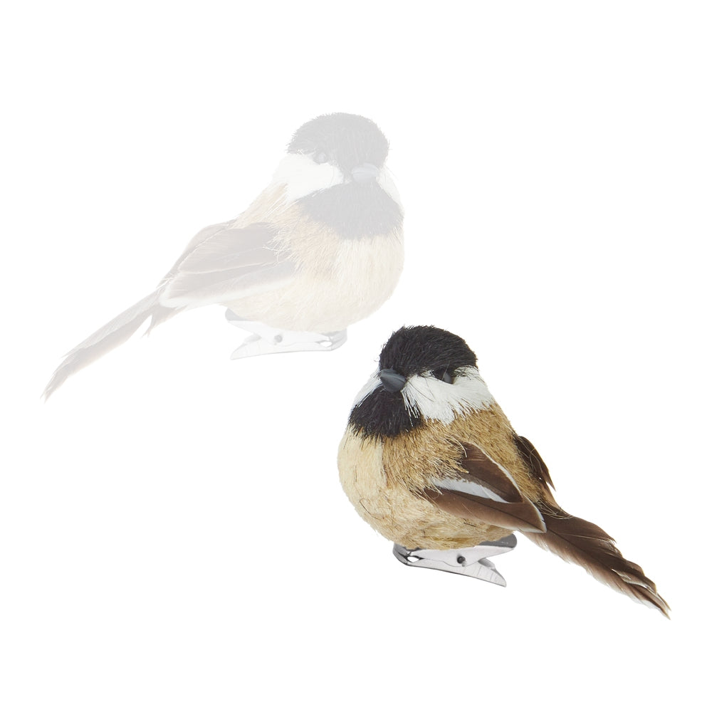 A small bird clipper decoration shaped like a chickadee, shown in two views on a plain white background: one in back in faded gray and one in front in full color. The bird has a black cap, white cheek, tan and brown body, and brown tail feathers.