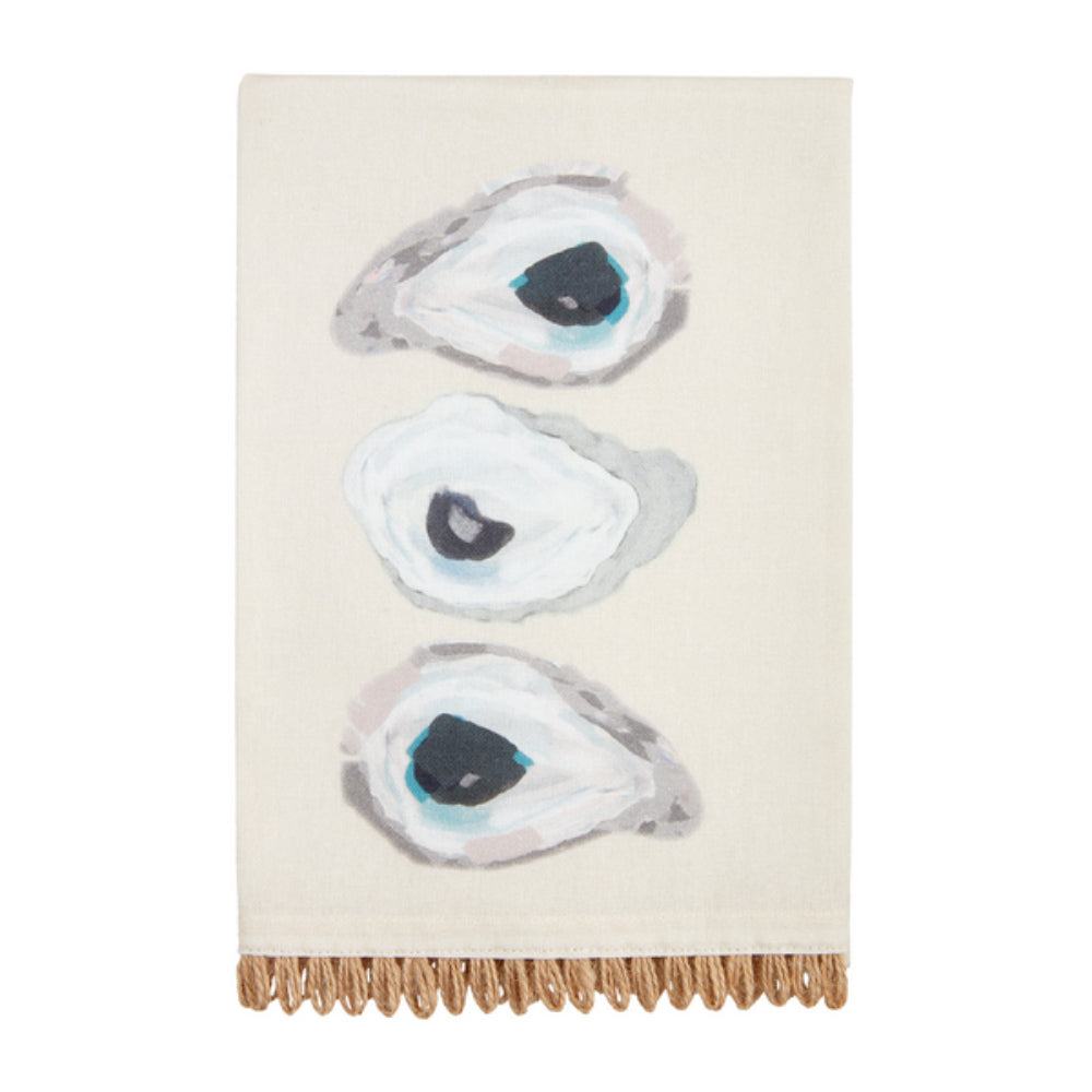A beige cotton hand towel with an abstract oyster shell pattern and jute trim.
