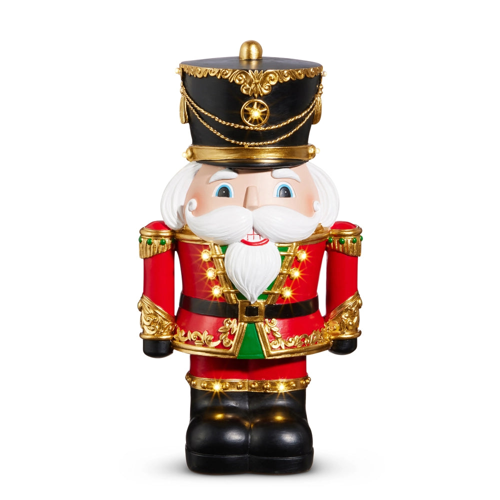 Decorative nutcracker figure with a festive outfit on a white background.