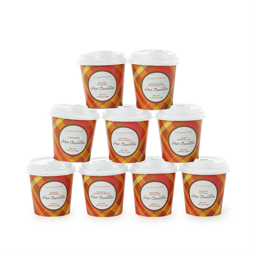 Nine small plastic cups of hot chocolate with white lids, arranged in a pyramid on a plain white background. The cups have a red and orange plaid pattern with a white oval label reading 'FRESH HOT CHOCOLATE'.