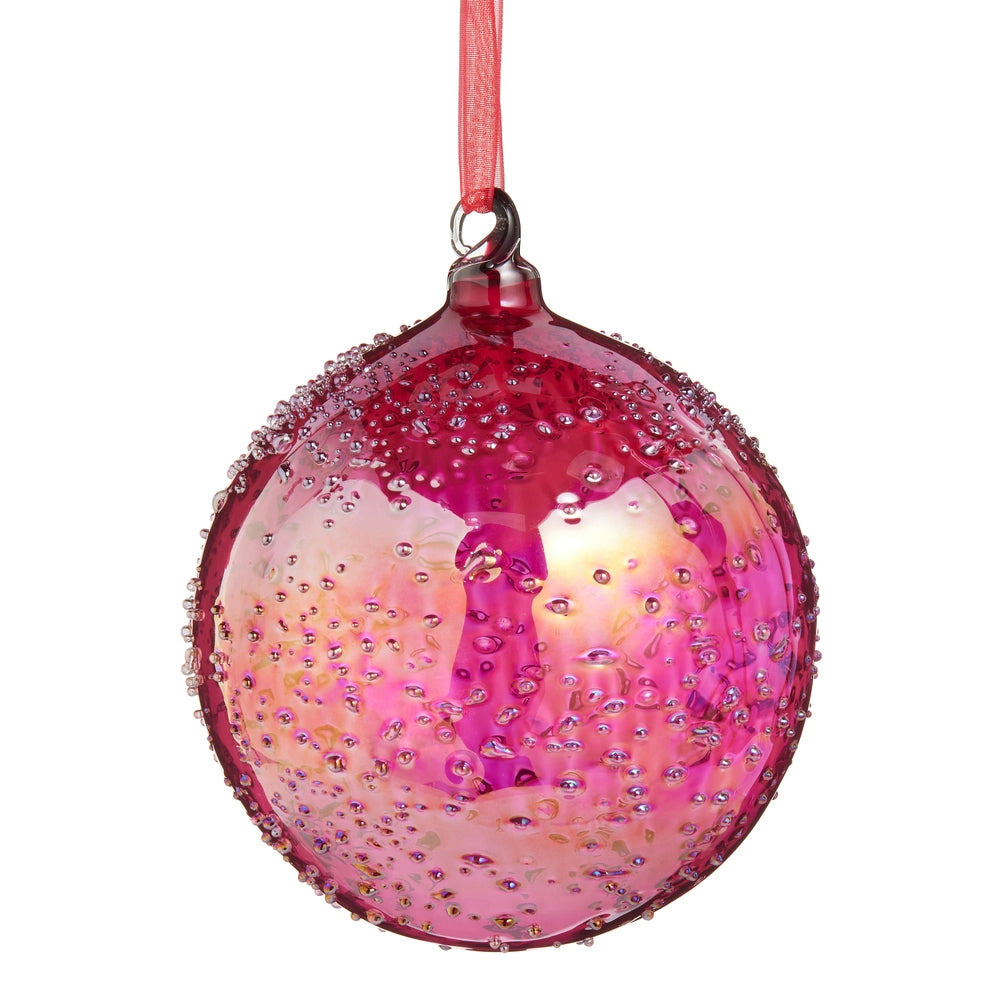 Pink Christmas ornament with rhinestones on a white background.