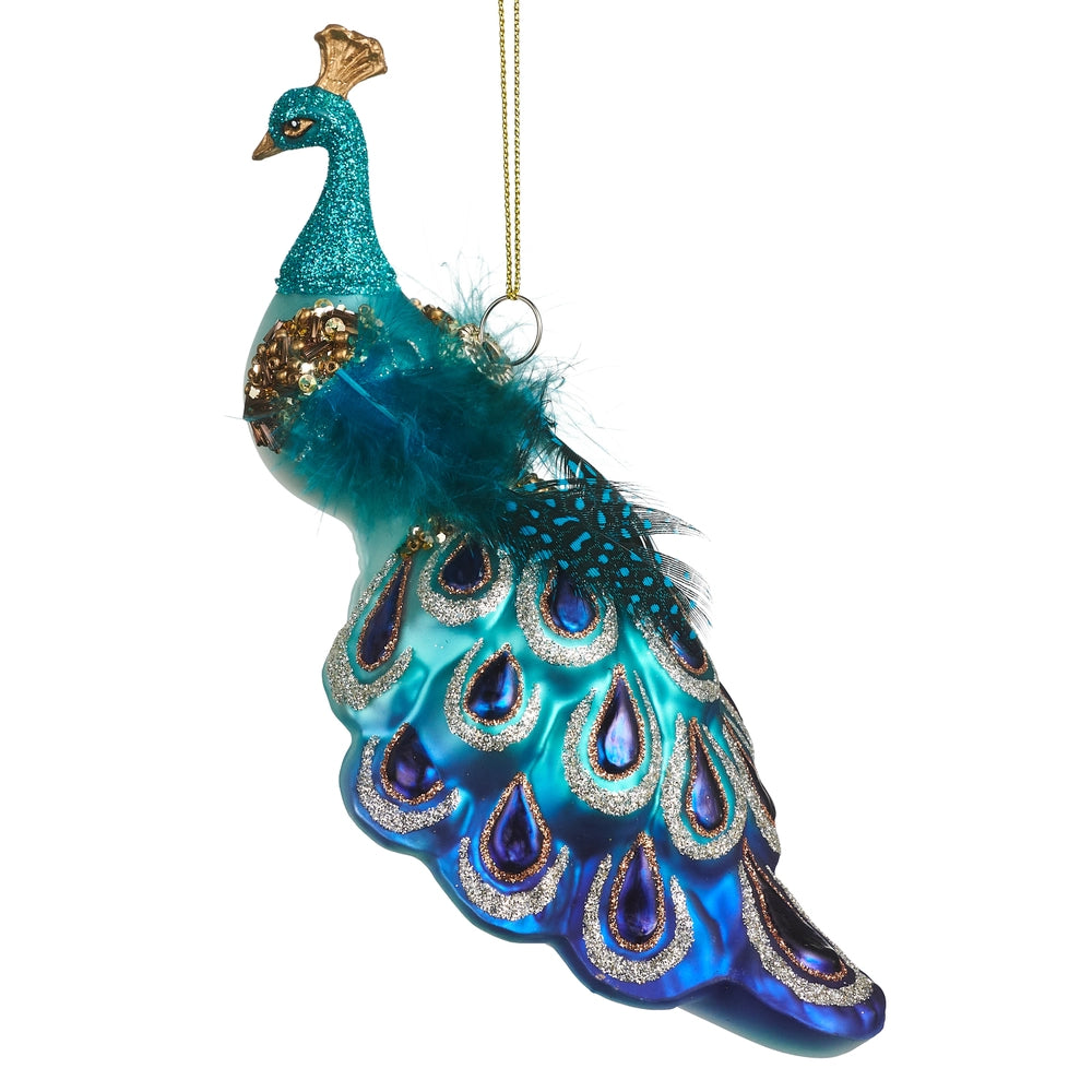 Decorative peacock ornament on a white background.