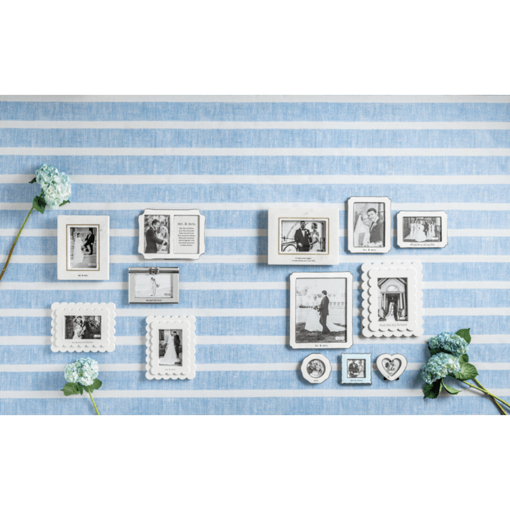 Collection of photo frames on a blue and white striped background