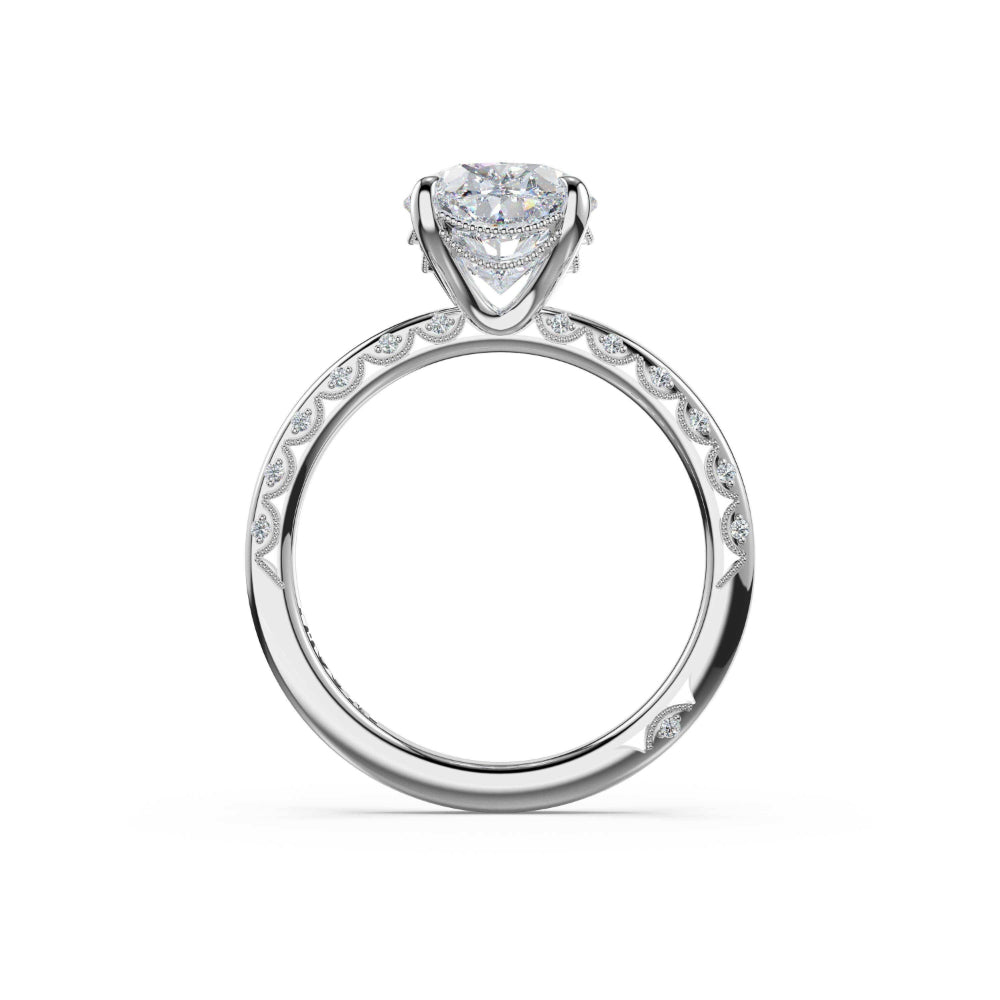 Silver ring with a heart-shaped center stone on a white background