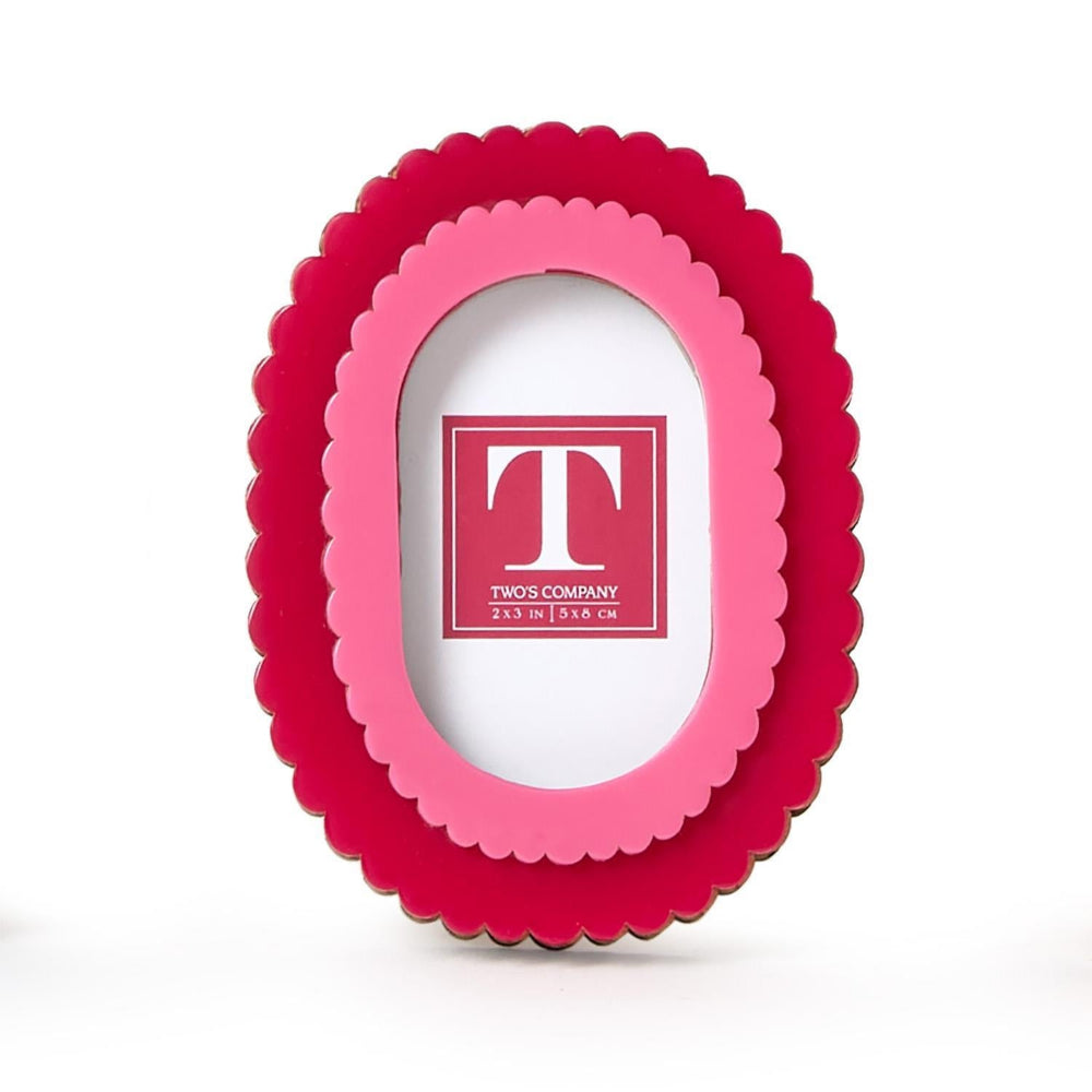 Two-tone red and pink scalloped photo frame with 'TWO'S COMPANY' logo on a white background