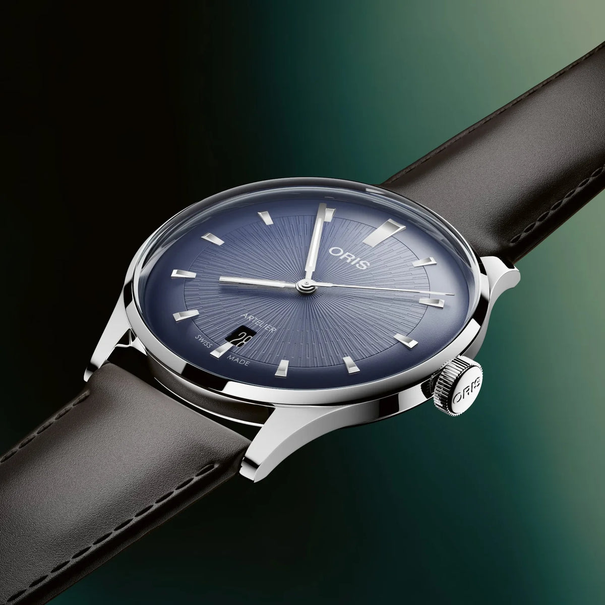 Oris watch with a blue dial and black leather strap on a gradient background