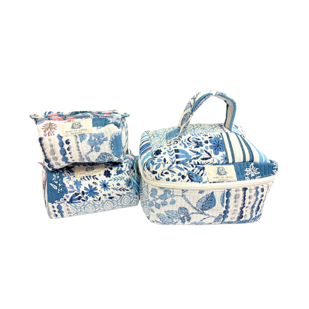 Set of three floral-patterned fabric bags on a white background