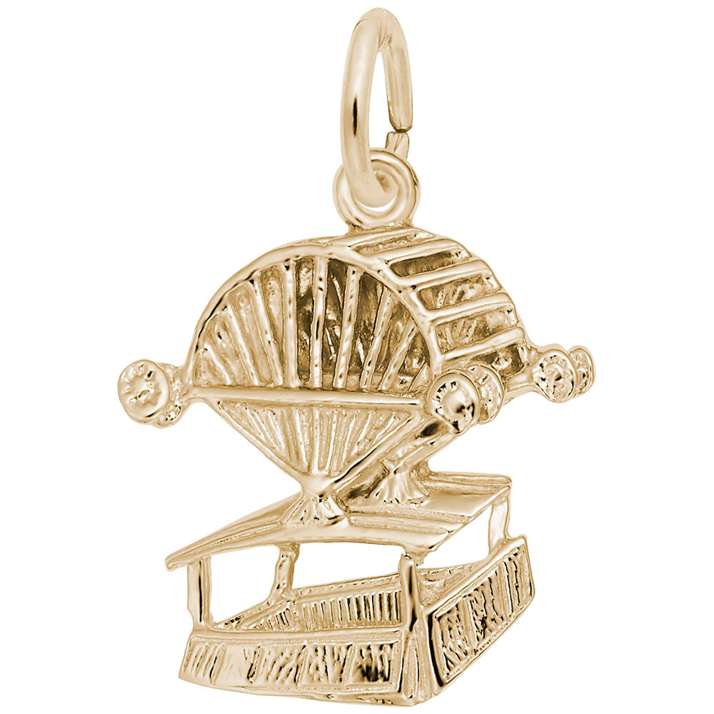 Gold aero car charm with engraved detailing, shown on a white background