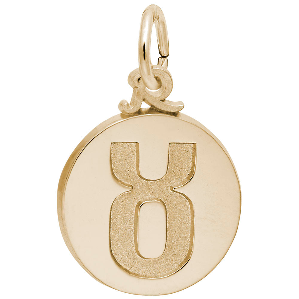 Gold disc charm with the Taurus symbol engraved in the center, shown on a white background