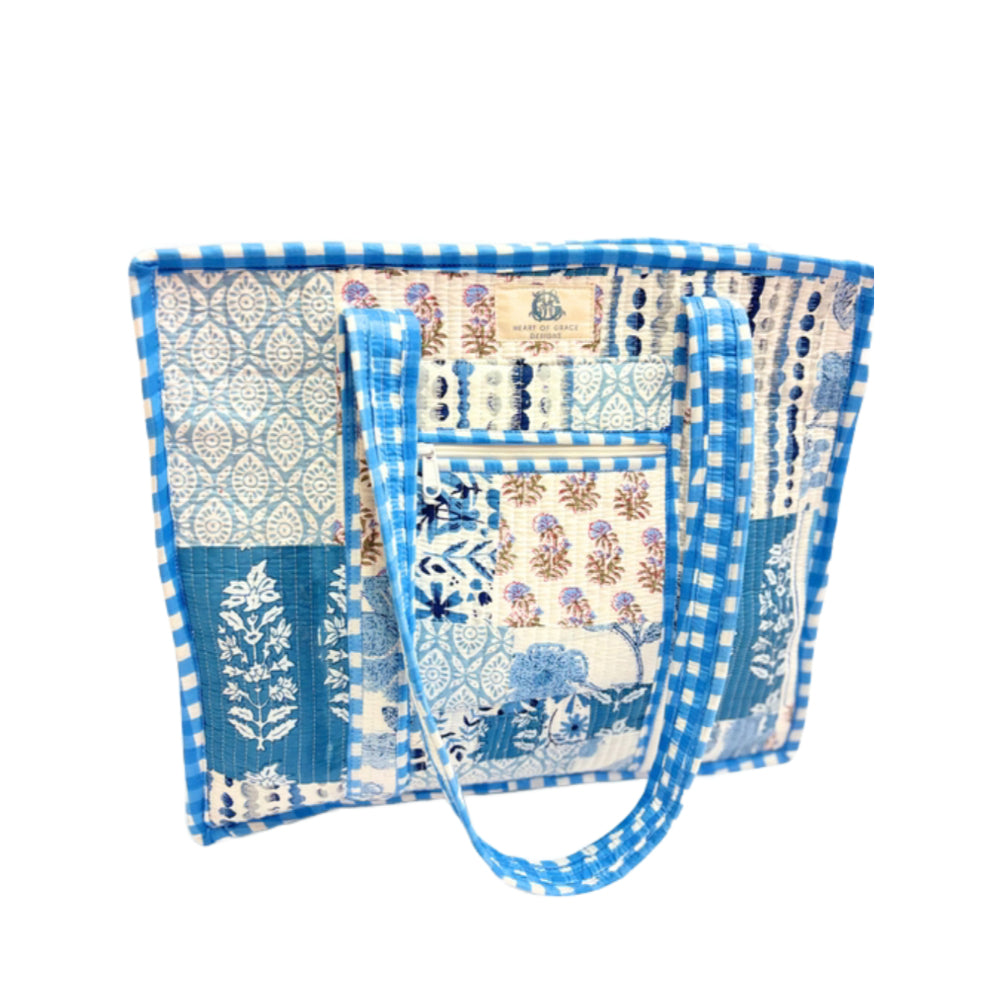 Blue and white patterned fabric bag on a white background