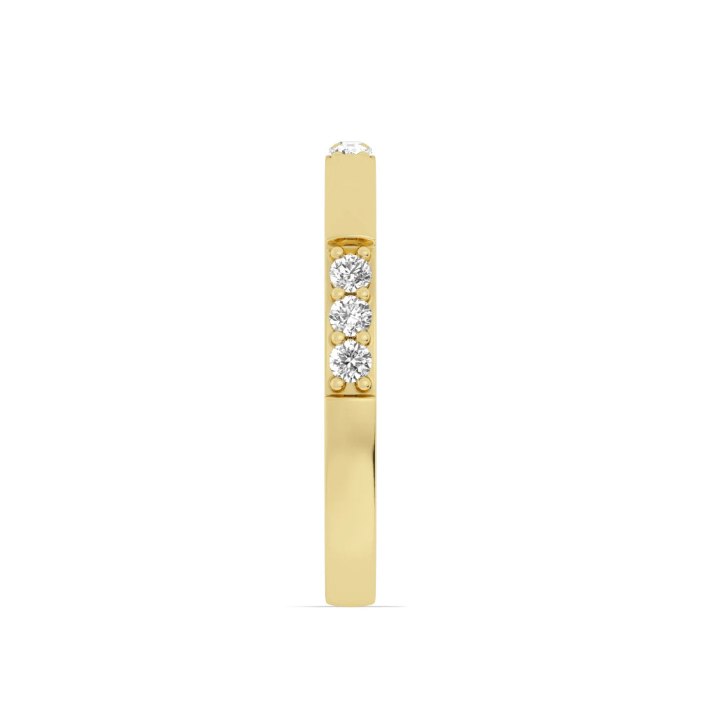 Gold ring with three diamonds on a white background
