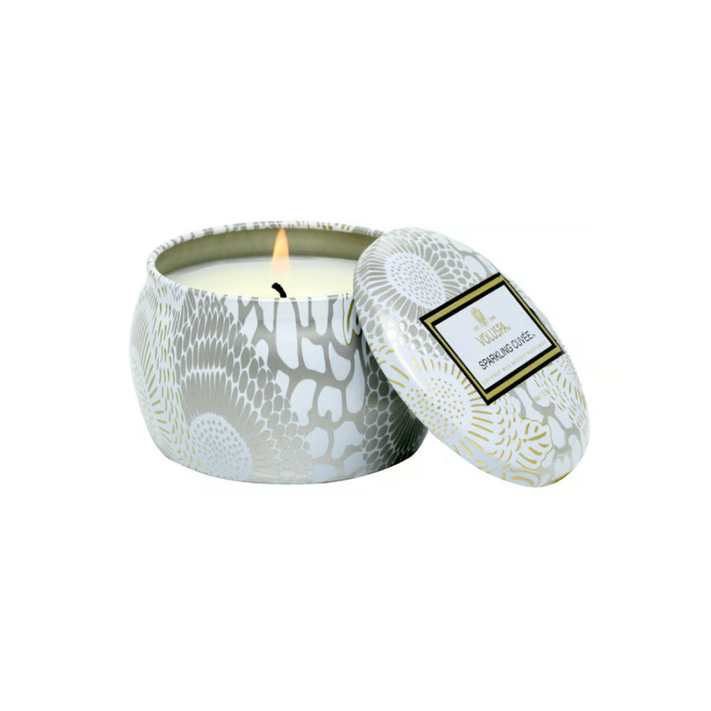 Tin Sparkling Cuvee mini candle with lid on a white backround.
