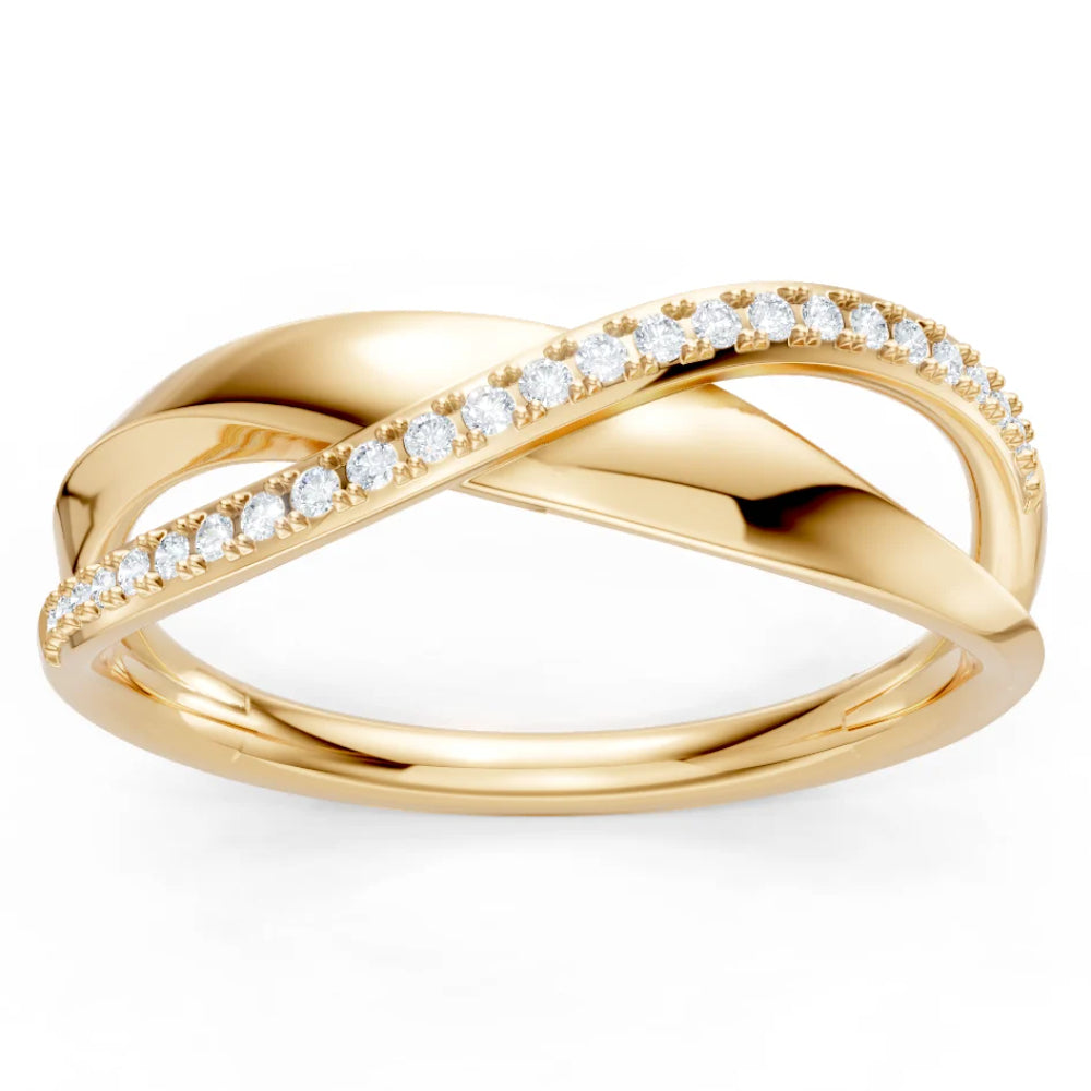 A yellow gold ring with an infinity-style twist design, featuring a row of small clear stones along the top curve, set against a plain white background.