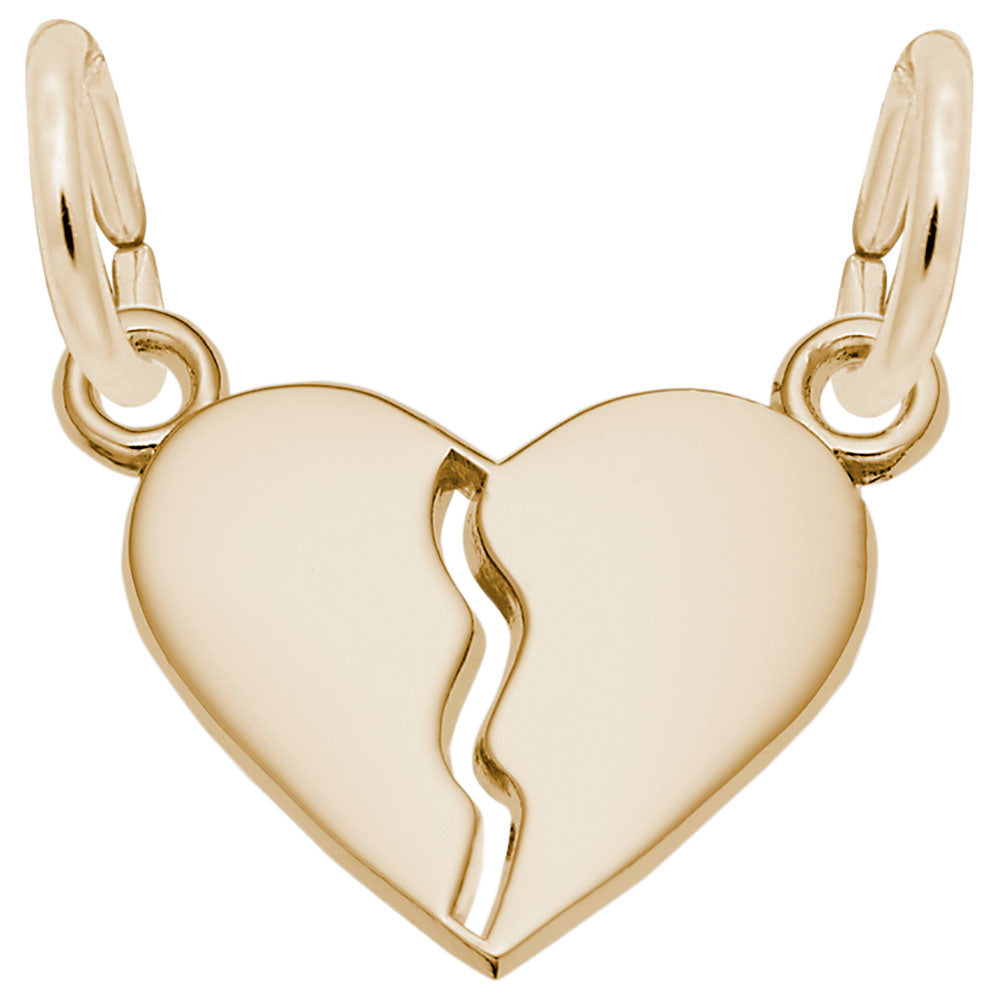 Gold heart-shaped charm with a break line on a white background