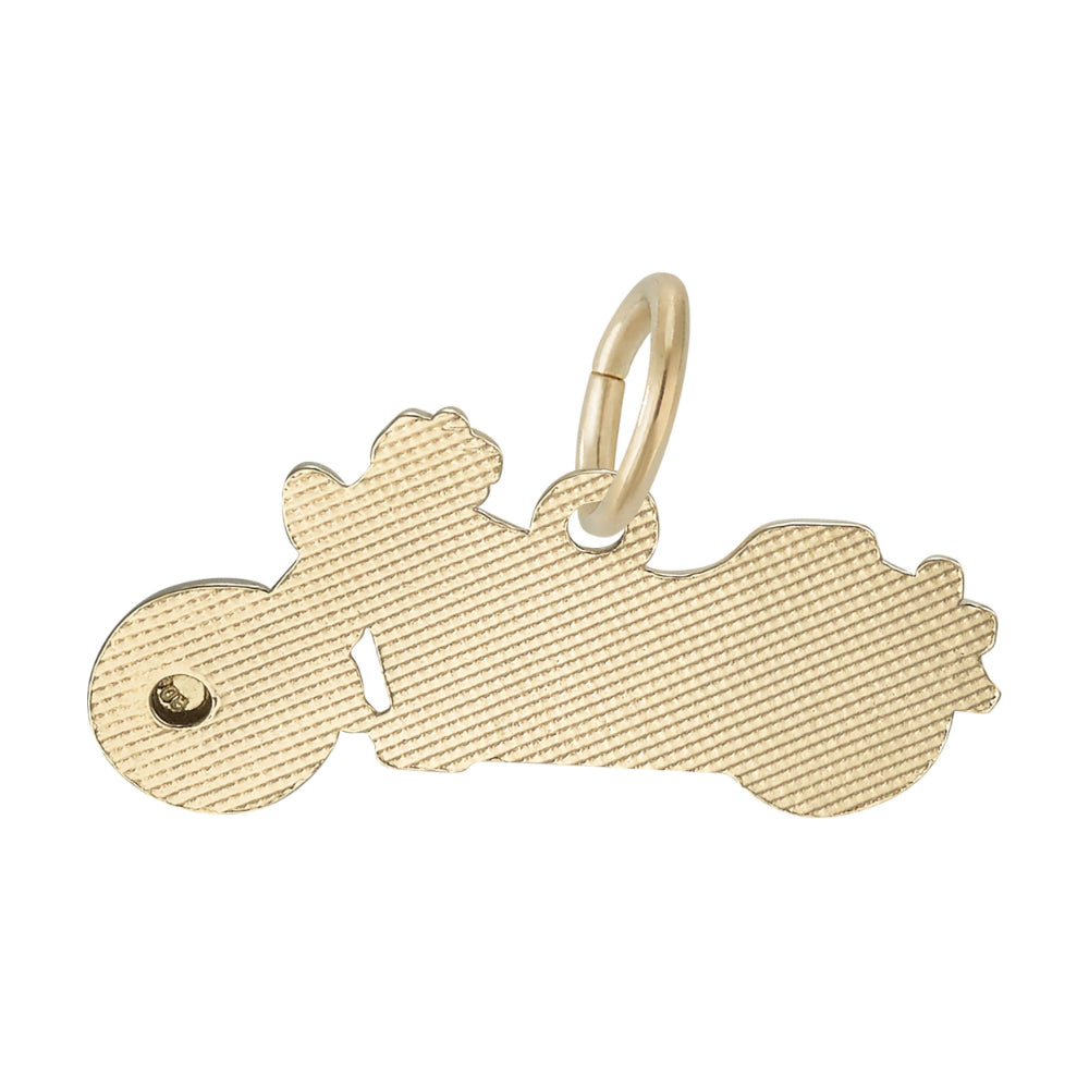 Textured plain back of a gold motorcycle charm, shown on a white background