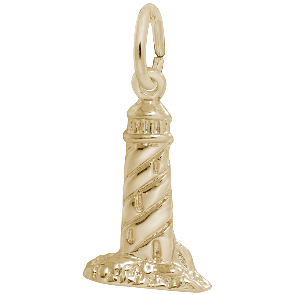 Gold lighthouse charm on a white background