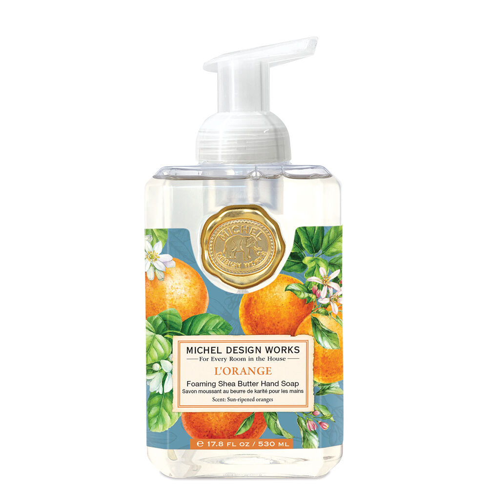Foaming hand soap bottle with orange design and Michel Design Works branding on a white background