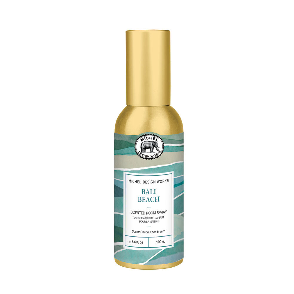 Michel Design Works Bali Beach Scented Room Spray in a 150ml bottle with a metallic gold cap and a teal and white patterned label.