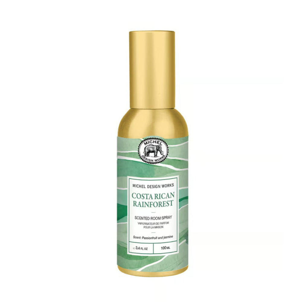 Michel Design Works Costa Rican Rainforest Scented Room Spray in a 100mL bottle with a metallic gold cap and a green and white label.