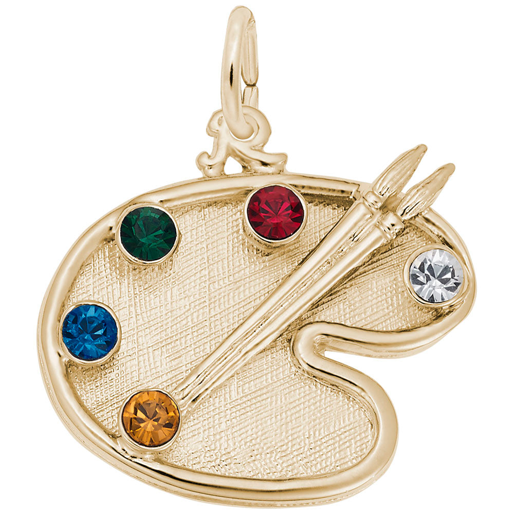 Gold artist palette with 5 colored gemstones on a white background